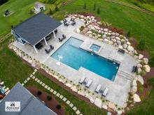 Drone shot of a Custom 34' x 34' Liberty Pool House with Lean-To Pavilion in Coopersburg PA