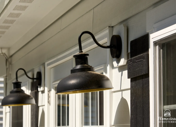 2 wall sconces on white pool house in Silver Spring, MD