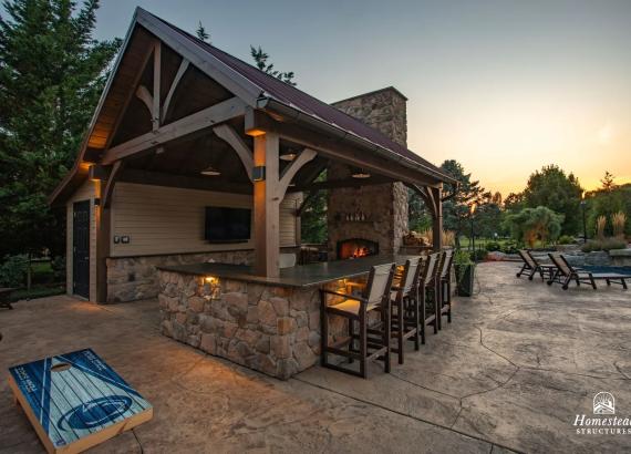 Photo of 16' x 20' Custom Timber Frame Pavilion with Double Sided Fireplace & Lean-To Shed in Orefield PA