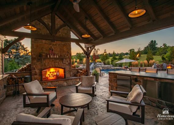 Photo of Inviting Fire in the Fireplace of a 16' x 20' Custom Timber Frame Pavilion with Lean-To Shed in Orefield PA