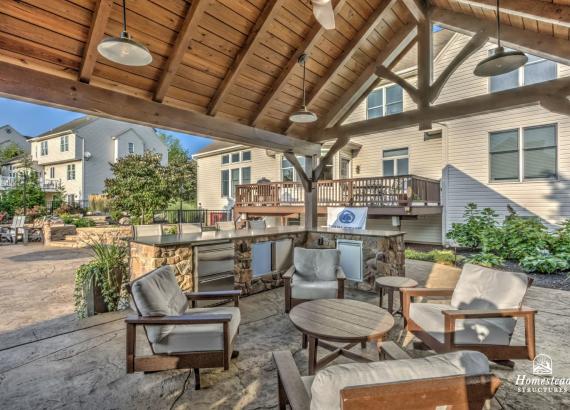 Shot of outdoor kitchen and bar in 16' x 20' Custom Timber Frame Pavilion with Double Sided Fireplace & Lean-To Shed in Orefield PA