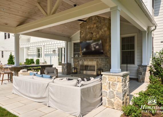 Outdoor furniture and TV space under a pavilion in Franklin Lakes, NJ