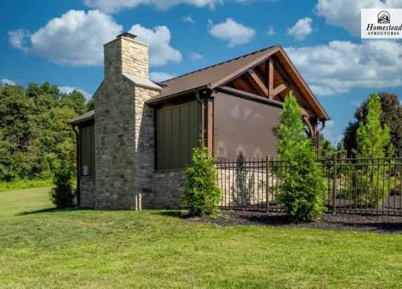 View of the back of a 20' x 25' Timber Frame Pavilion with Fireplace & Outdoor Kitchen in Pennsburg PA