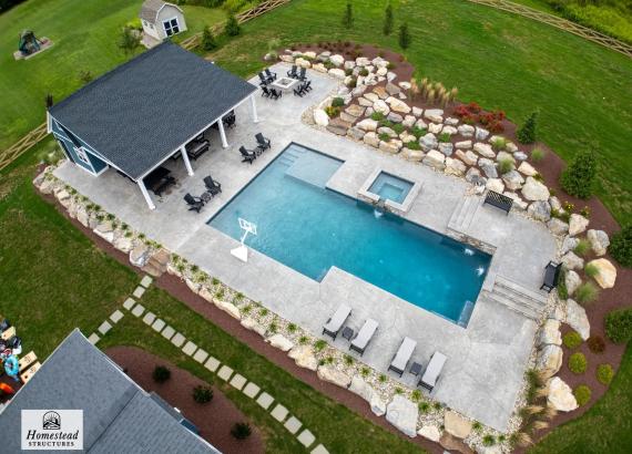 Drone shot of a Custom 34' x 34' Liberty Pool House with Lean-To Pavilion in Coopersburg PA