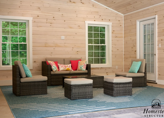 Stylish furniture inside the pool house, creating a comfortable and inviting space.